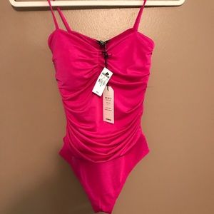 Express Body Contour Silky Ruched Thong Bodysuit in Neon Berry, Size XS.